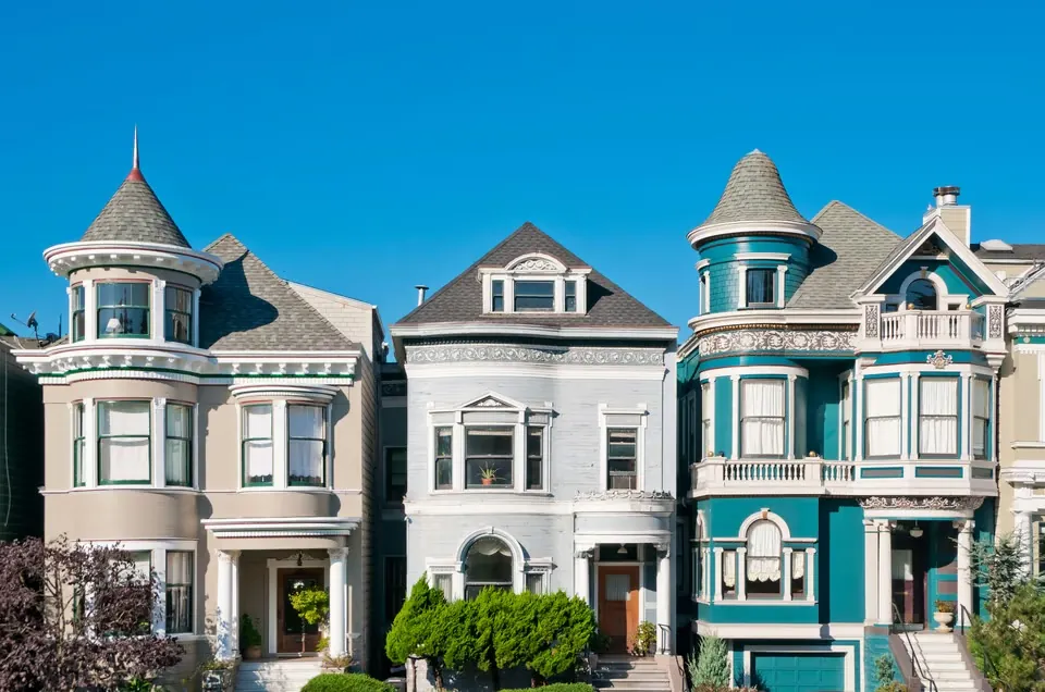 Colorful San Francisco Victorian homes beneath a clear sky